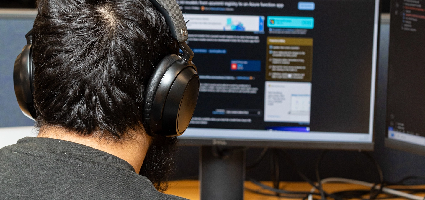A Data Science apprentice working at his desk.