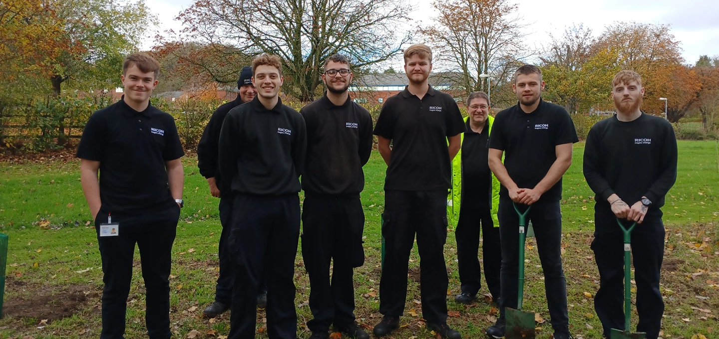 Apprentices lined up on the field