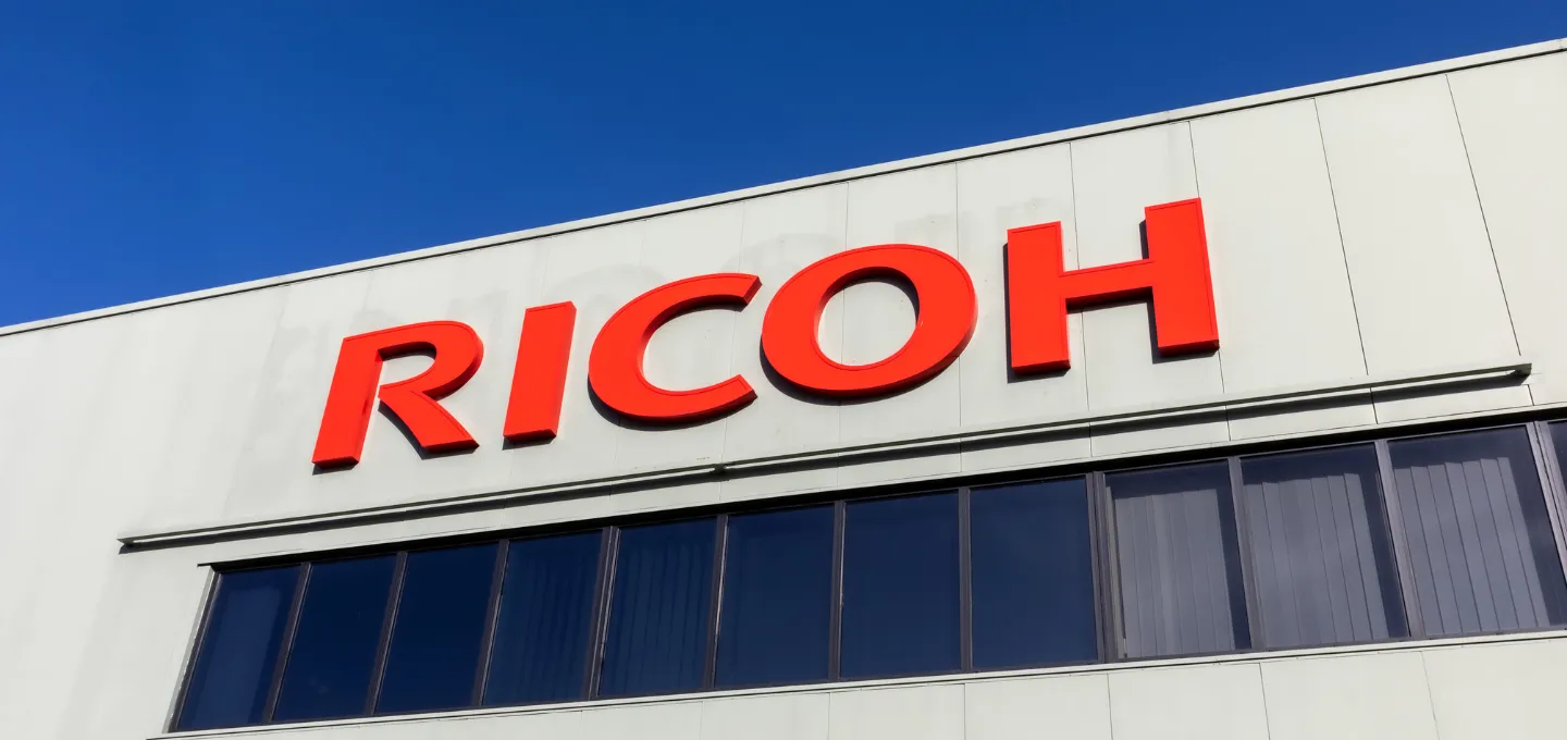 RICOH signage on the main building at Ricoh UK Products Ltd.
