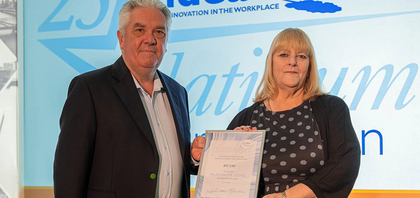 jayne garder, scheme owner receiving platinum accreditation certificate from ideasuk