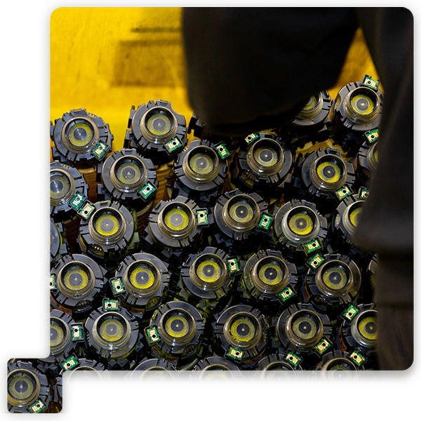 Toner bottles stacked in a yellow box